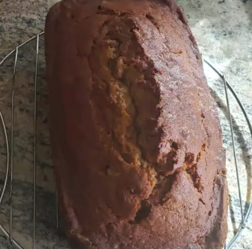 Deliciously moist Pumpkin Banana Loaf with a golden brown crust.