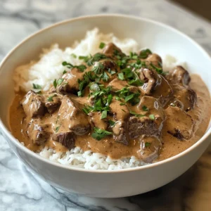 Beef Stroganoff served with creamy sauce and noodles.