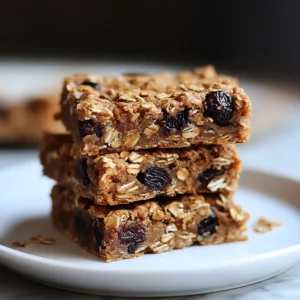 Bowl of Oatmeal-Raisin Breakfast with fresh fruit and nuts on top.