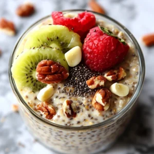 Jar of Overnight Oats with Chia Seeds topped with fresh berries and honey.