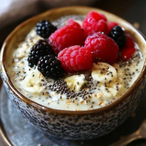 Jar of Overnight Oats with Chia Seeds topped with fresh berries and honey.