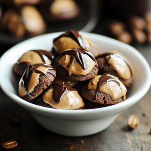 Peanut Butter Blossoms featuring soft, chewy peanut butter cookies topped with a classic chocolate kiss for a perfect sweet treat.